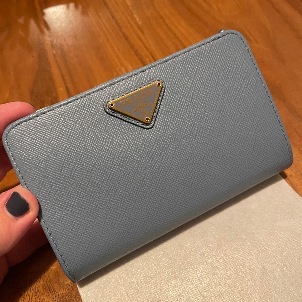 Saffiano triangle Prada wallet.